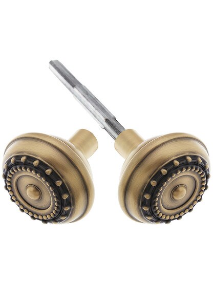 Pair of Meadows Door Knobs In Antique Brass.